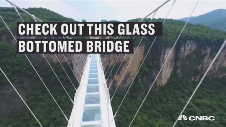World’s highest glass-bottomed bridge opens in China