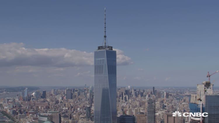Watch these men climb One World Trade Center's spire