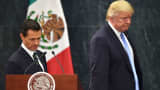 US presidential candidate Donald Trump (R) and Mexican President Enrique Pena Nieto prepare to deliver a joint press conference in Mexico City on August 31, 2016.