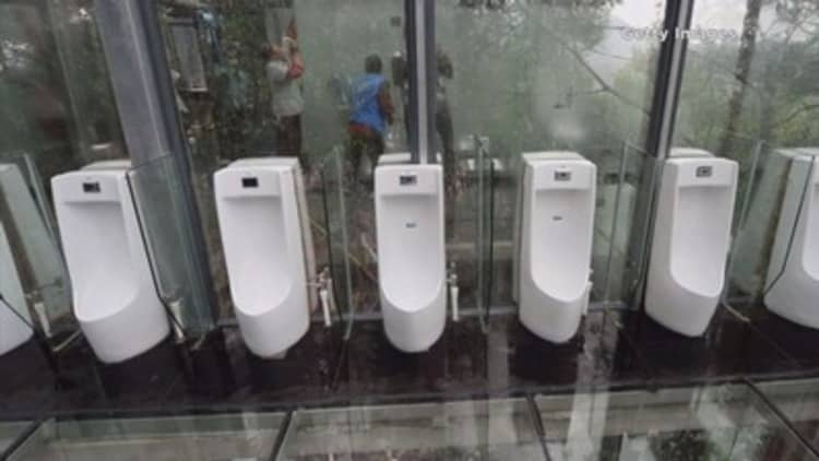 China unveils glass-walled toilets