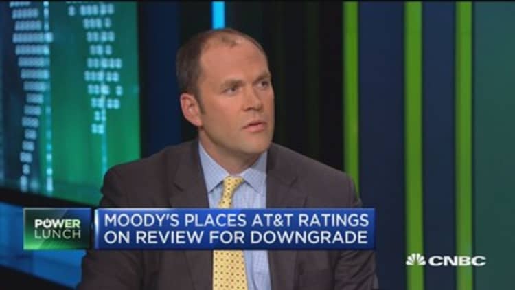 Moody's places AT&T ratings on review