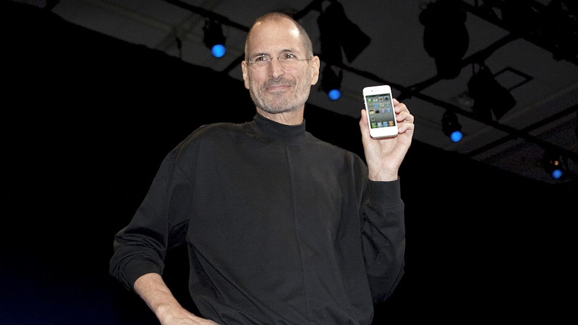 Steve Jobs, chief executive officer of Apple Inc., unveils the iPhone 4 during his keynote address at the Apple Worldwide Developers Conference (WWDC) in San Francisco, California, U.S.