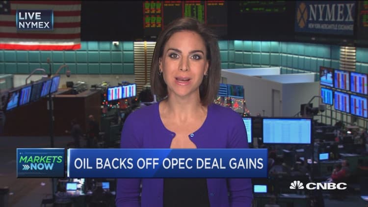 Oil backs off OPEC deal gains