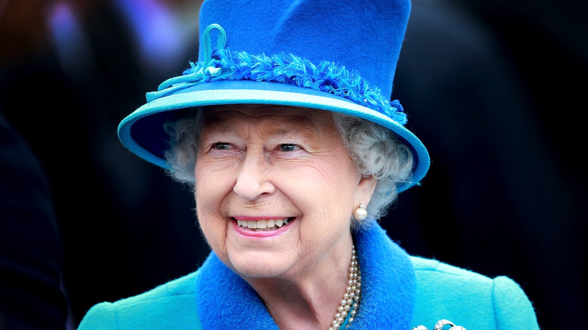 Queen Elizabeth II, then age 89, smiles as she arrives at Tweedbank Station in Scotland, Sept. 9, 2015.