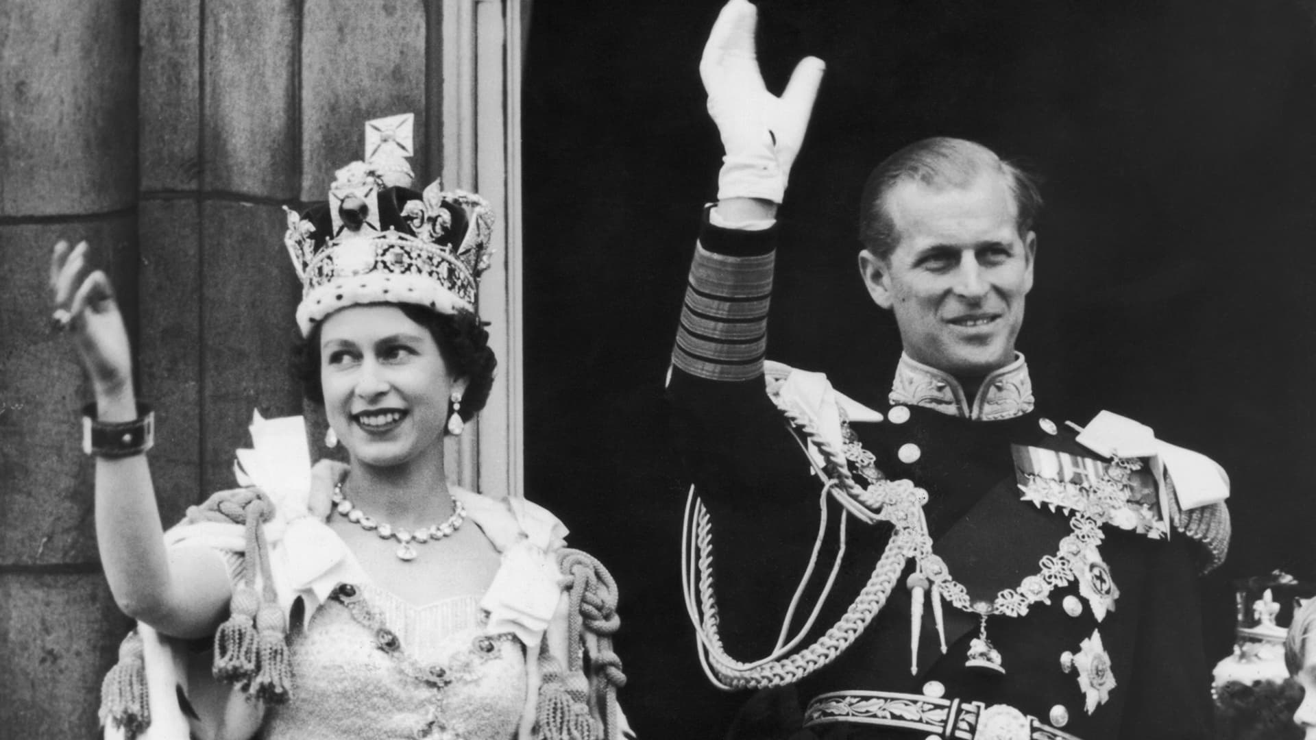 Queen Elizabeth II and the Duke of Edinburgh wave from the balcony at Buckingham Palace during the queen's coronation celebrations June 2, 1953.