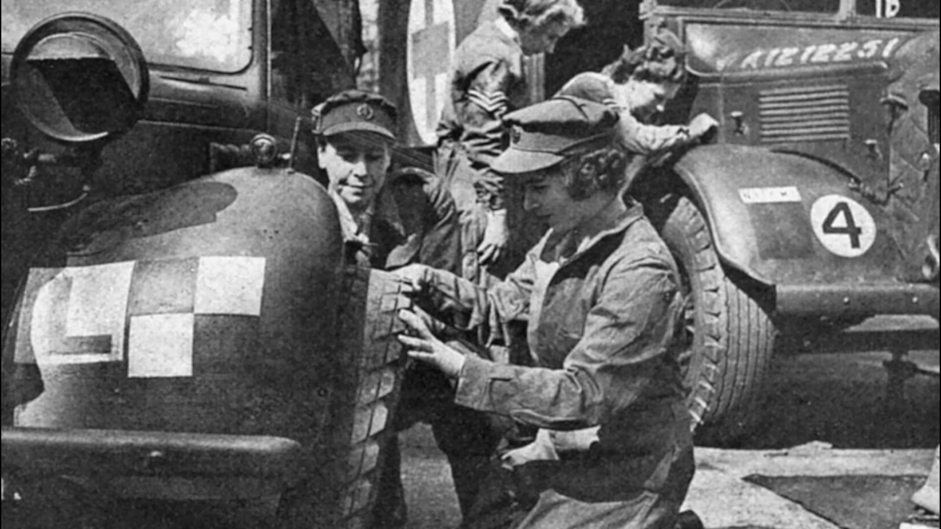 Then-Princess Elizabeth learns how to change a car tire as an auxiliary officer of the English Army, 1945.