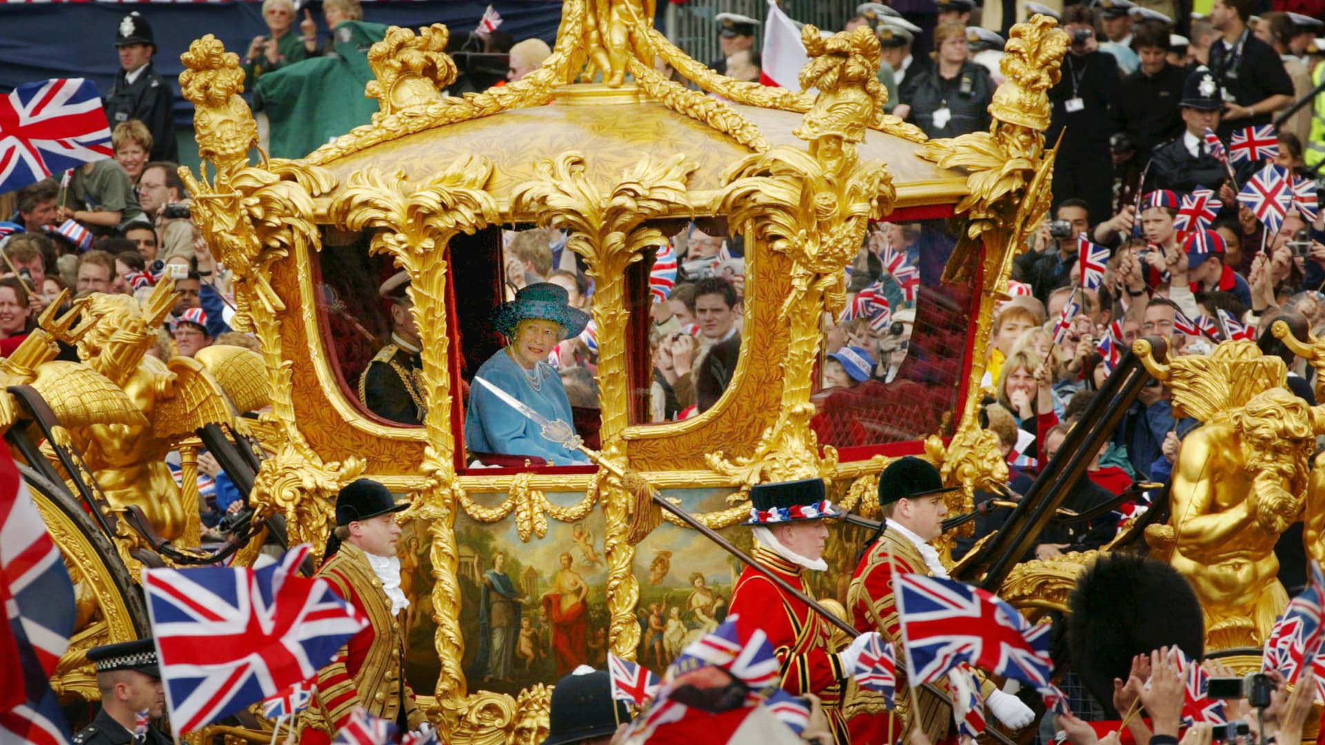 Queen Elizabeth and Prince Philip ride in the Golden State Carriage at the head of a parade celebrating the queen's Golden Jubilee, June 4, 2002