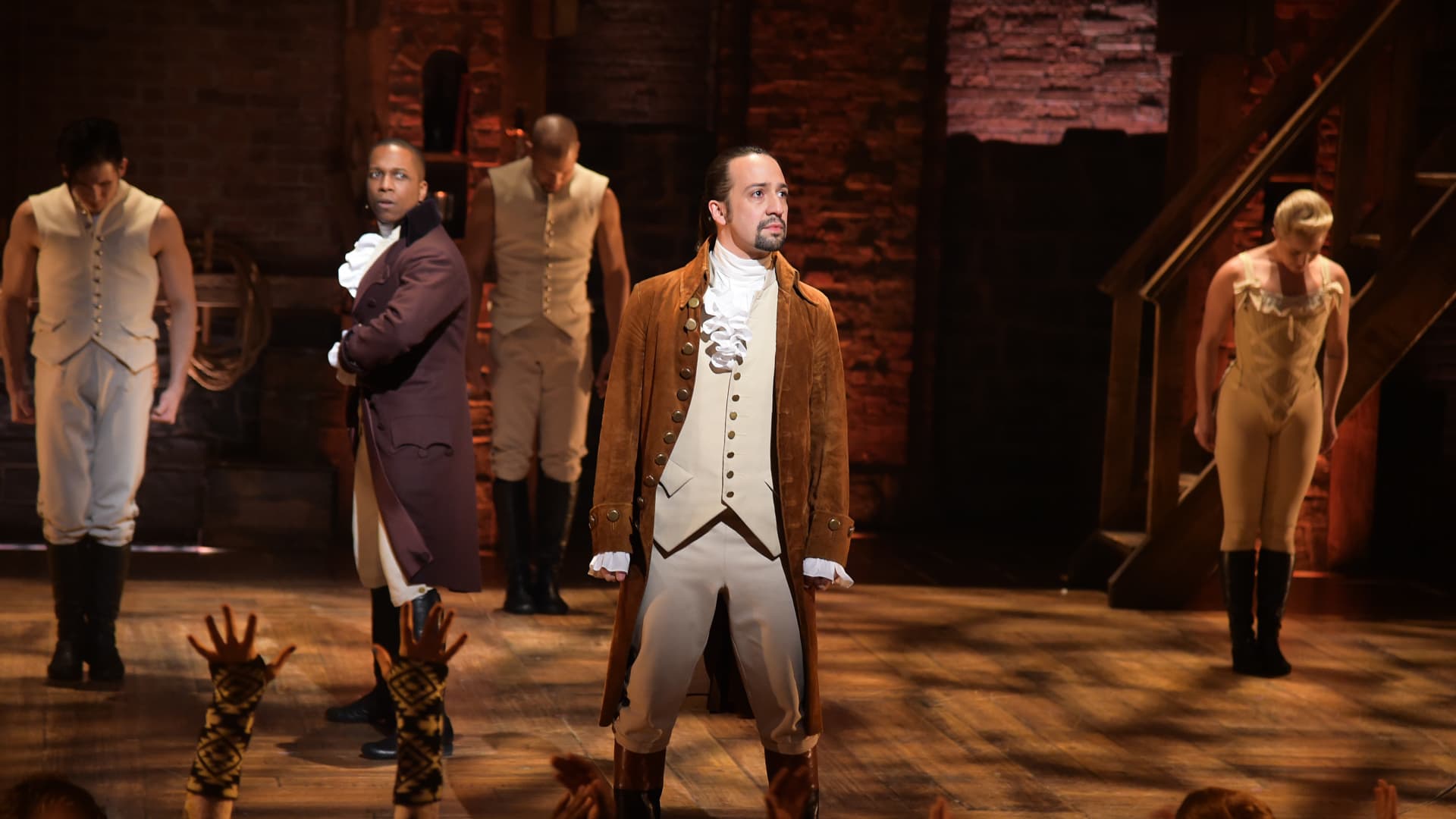 Actor Leslie Odom, Jr. (L) and actor, composer Lin-Manuel Miranda (R) and cast of 'Hamilton' perform on stage during 'Hamilton' GRAMMY performance for The 58th GRAMMY Awards at Richard Rodgers Theater in New York City.