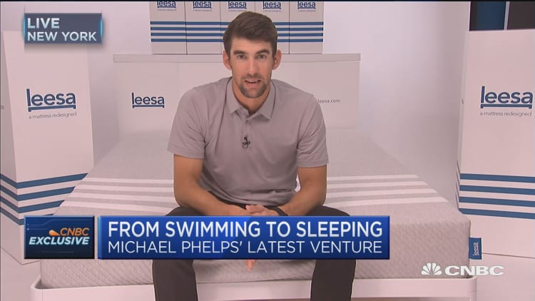 Michael Phelps transitions from swimming to sleeping