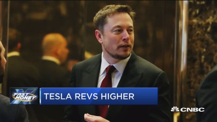 Tesla revs higher