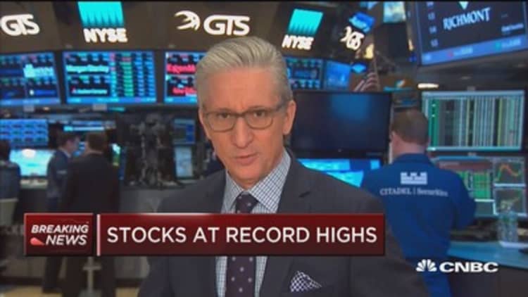 Stocks continue rally to record highs