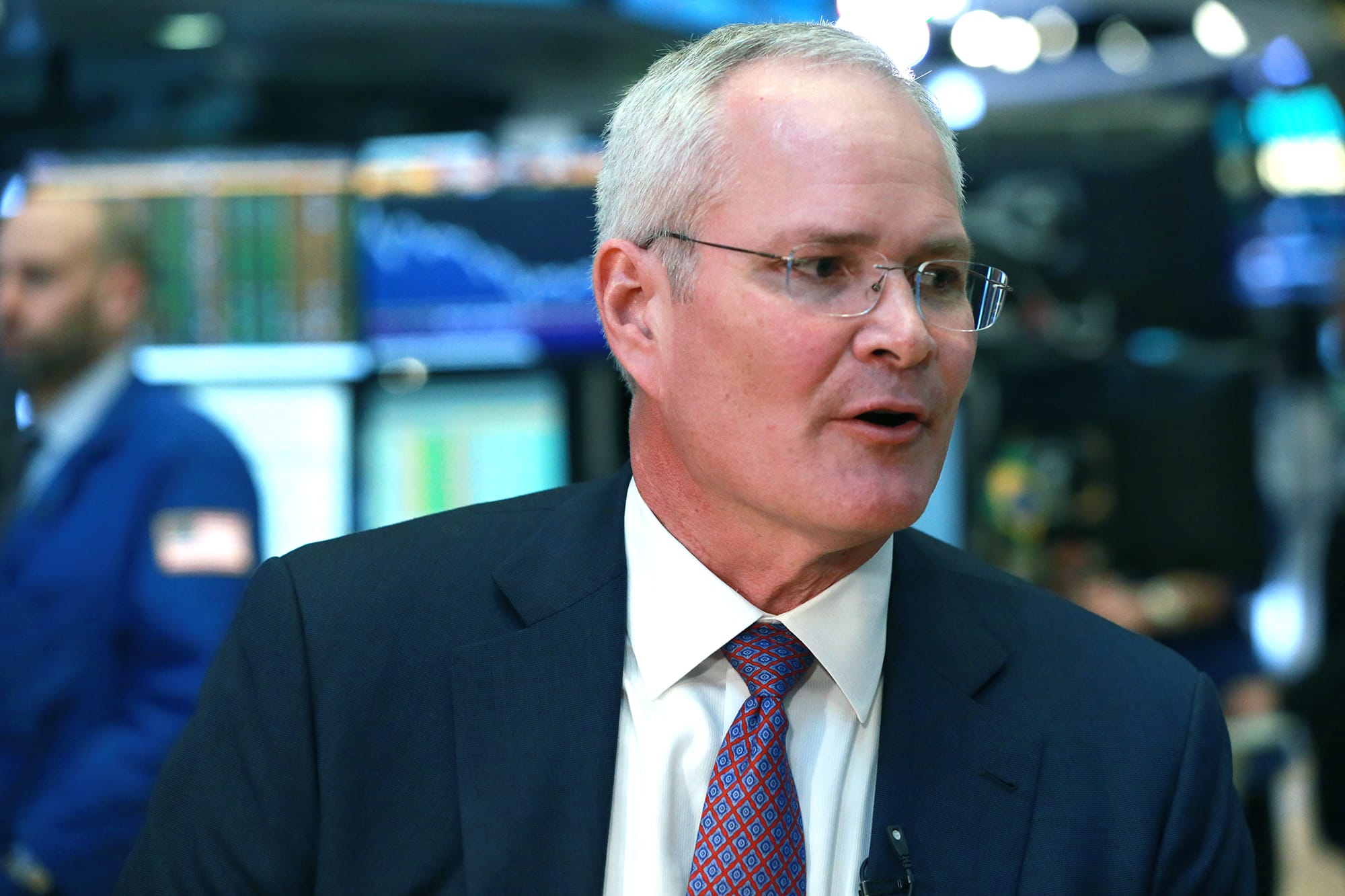 Exxon CEO Darren Woods promises a strong dividend despite losses in 2020
