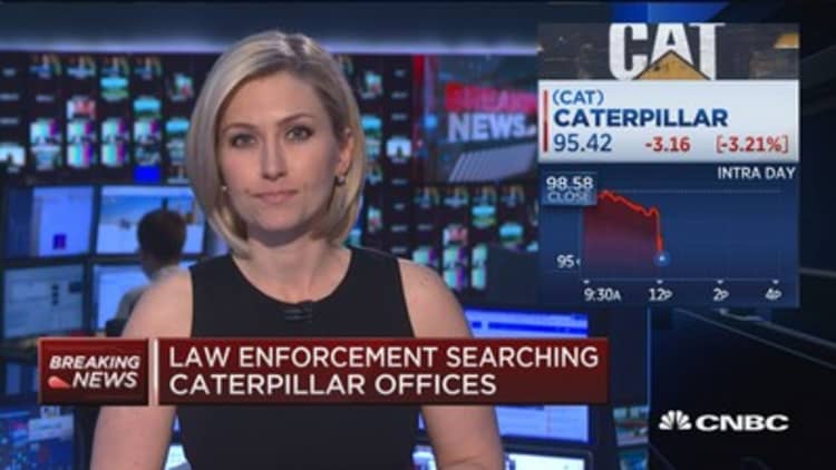 Law enforcement searching Caterpillar offices