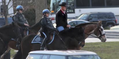 Interior secretary Ryan Zinke rides a horse to work