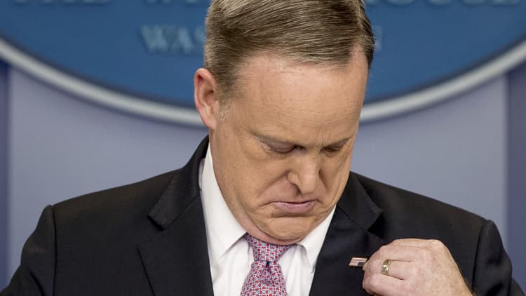 Sean Spicer flips his flag pin