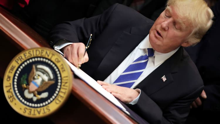 President Trump signs massive tax overhaul bill