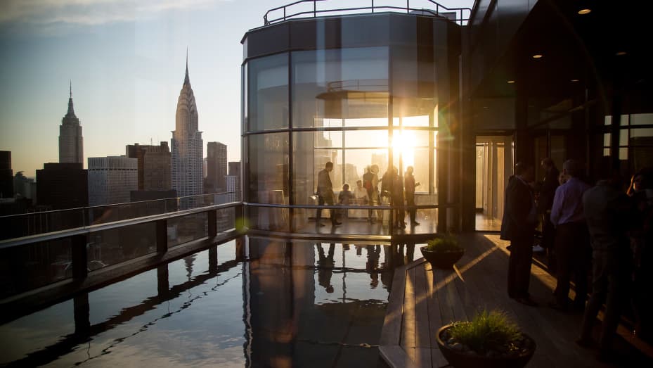 Guests attend a pool party in the penthouse apartment at the 50 United Nations Plaza building in New York.