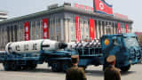Military vehicles carry missiles during a parade marking the 105th anniversary of the birth of North Korea's founding father Kim Il-sung in Pyongyang on April 15, 2017.