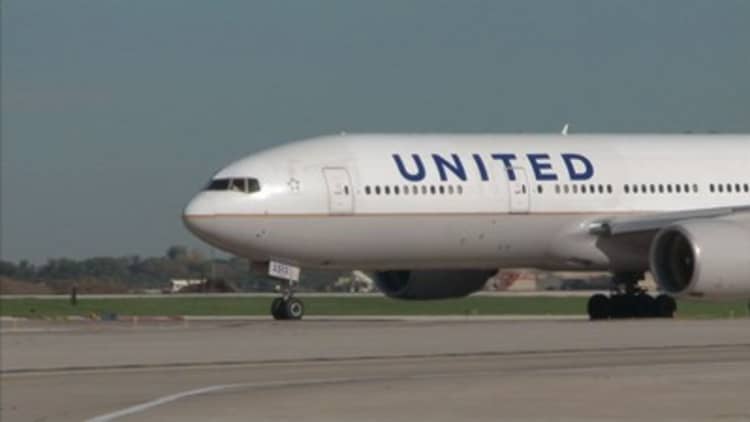 A couple headed toward their wedding was booted off a United flight