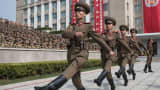 Korean People's Army (KPA) soldiers march to their positions prior to a military parade marking the 105th anniversary of the birth of late North Korean leader Kim Il Sung, in Pyongyang on April 15, 2017.
