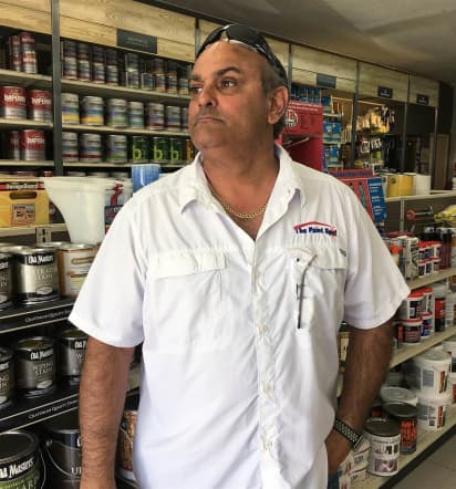 Paint shop owner Juan Carlos Enriquez took on Trump — and won