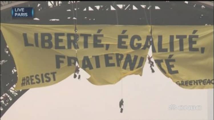 Greenpeace activists deploy anti-Le Pen banner at Eiffel Tower