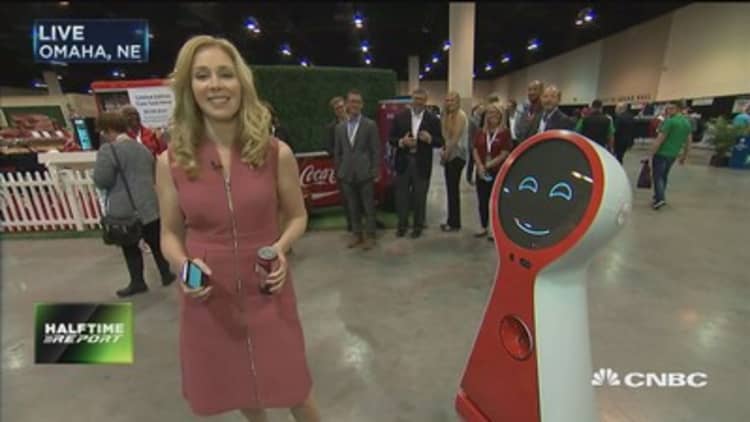 Coca Cola robot greets CNBC's Becky Quick ahead of Berkshire Hathaway's annual meeting
