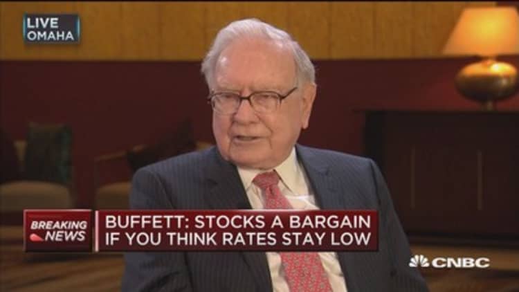 Buffett: Stocks a bargain if you think rates stay low