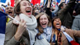 Supporters of French president-elect Emmanuel Macron react at the Louvre Museum in Paris on May 7, 2017, after the second round of the French presidential election.