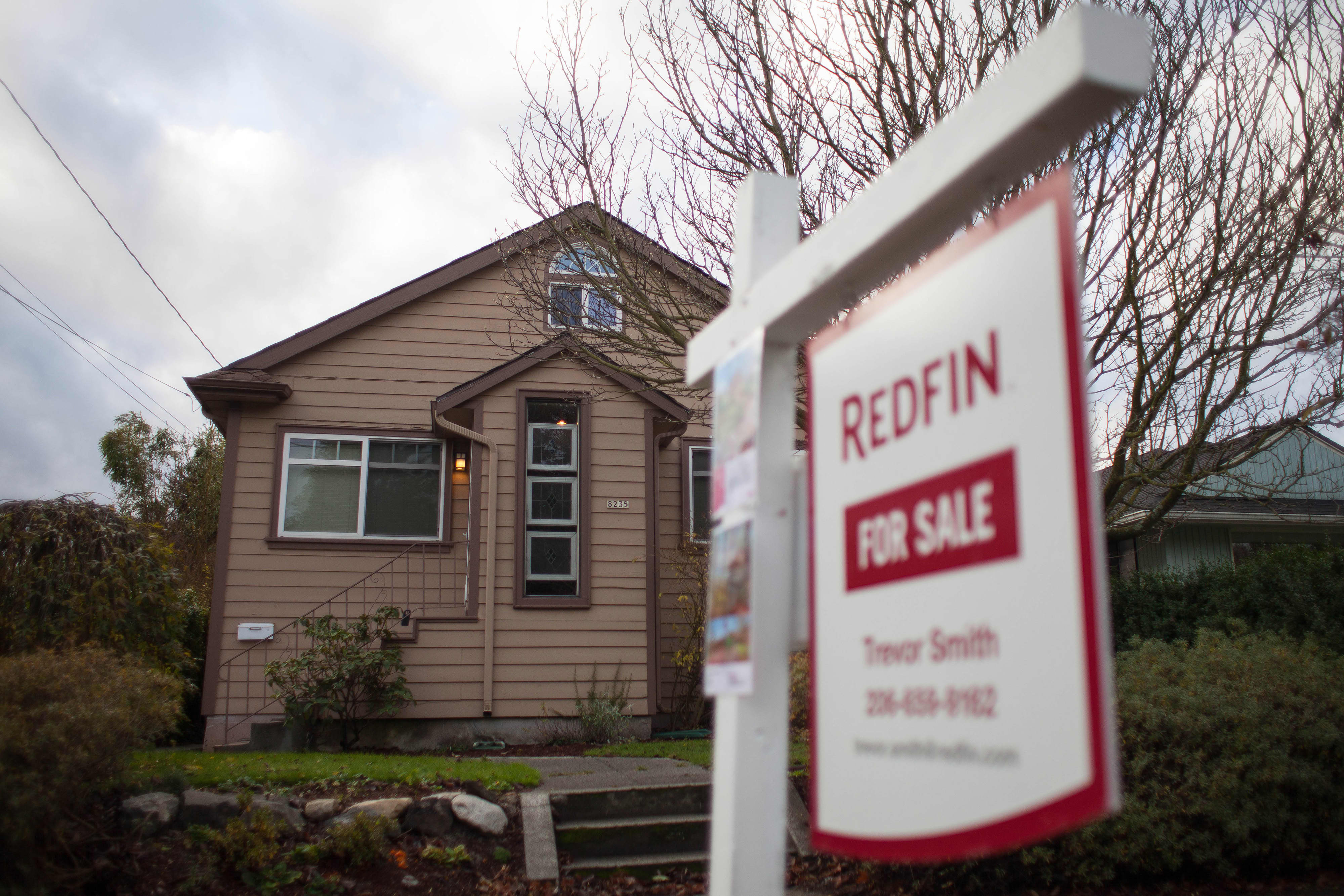 Real estate firms Compass and Redfin announce layoffs as housing market slows