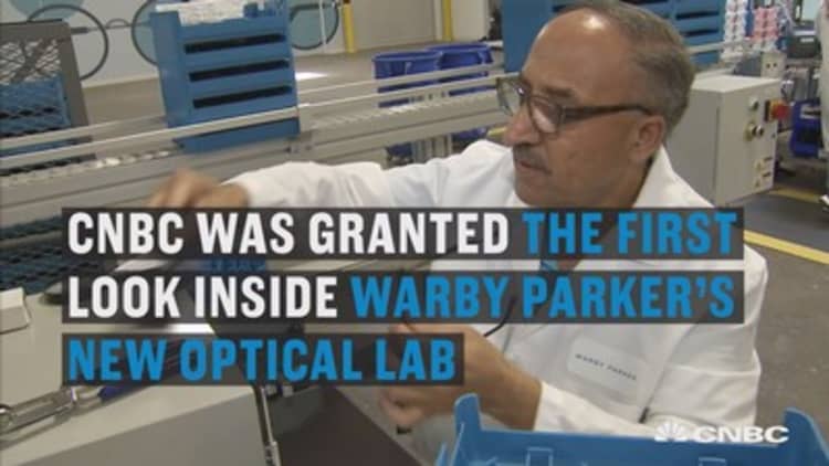 Here's how a new optical lab is helping keep costs at bay for Warby Parker. 