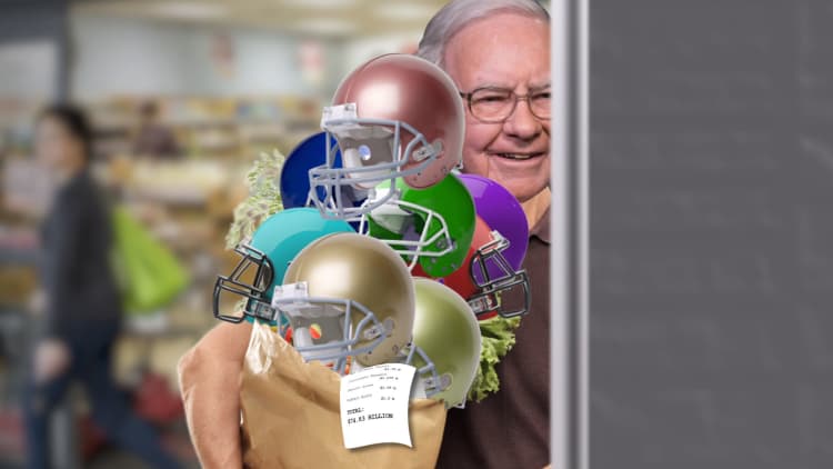 How many NFL football franchises can Warren Buffett purchase?