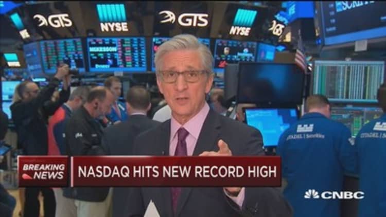 Markets open higher as Nasdaq hits new record high
