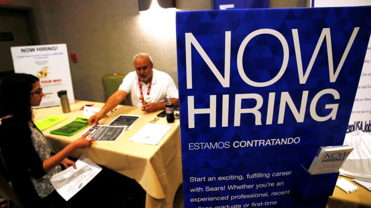 Initial jobless claims down 9,000 to 221,000