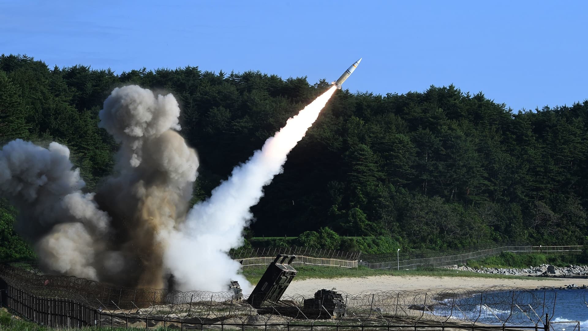 In this handout photo released by the South Korean Defense Ministry, U.S. M270 Multiple Launch Rocket System firing an MGM-140 Army Tactical Missile during a U.S. and South Korea joint missile drill aimed to counter North Korea's intercontinental ballistic missile test on July 5, 2017 in East Coast, South Korea.