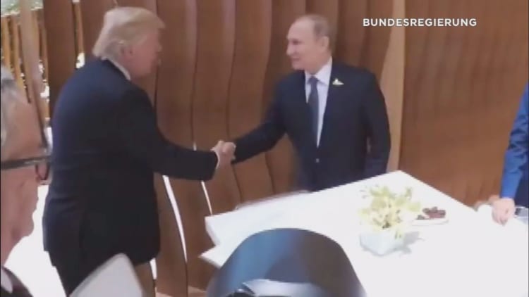 Trump-Putin shake hands in first ever face-to-face meeting