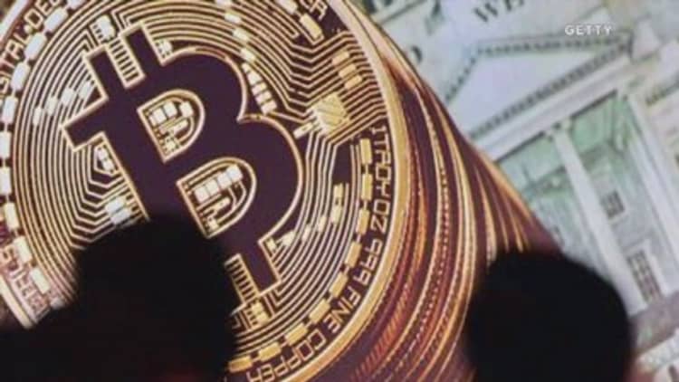 Bitcoin falls to near one-month low with $12 billion wiped off value since record high 30 days ago