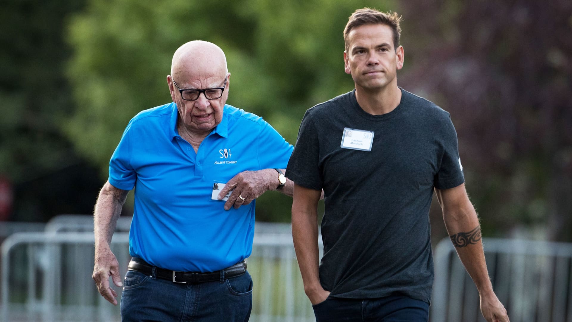 (L to R) Rupert Murdoch, executive chairman of News Corp and chairman of Fox News, and Lachlan Murdoch, co-chairman of 21st Century Fox, walk together as they arrive on the third day of the annual Allen & Company Sun Valley Conference, July 13, 2017 in Sun Valley, Idaho.