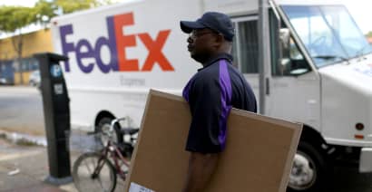 FedEx shares sank Friday after the company cited weakening global demand