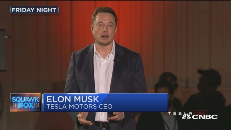 Tesla delivers first 30 Model 3 mass-market sedans