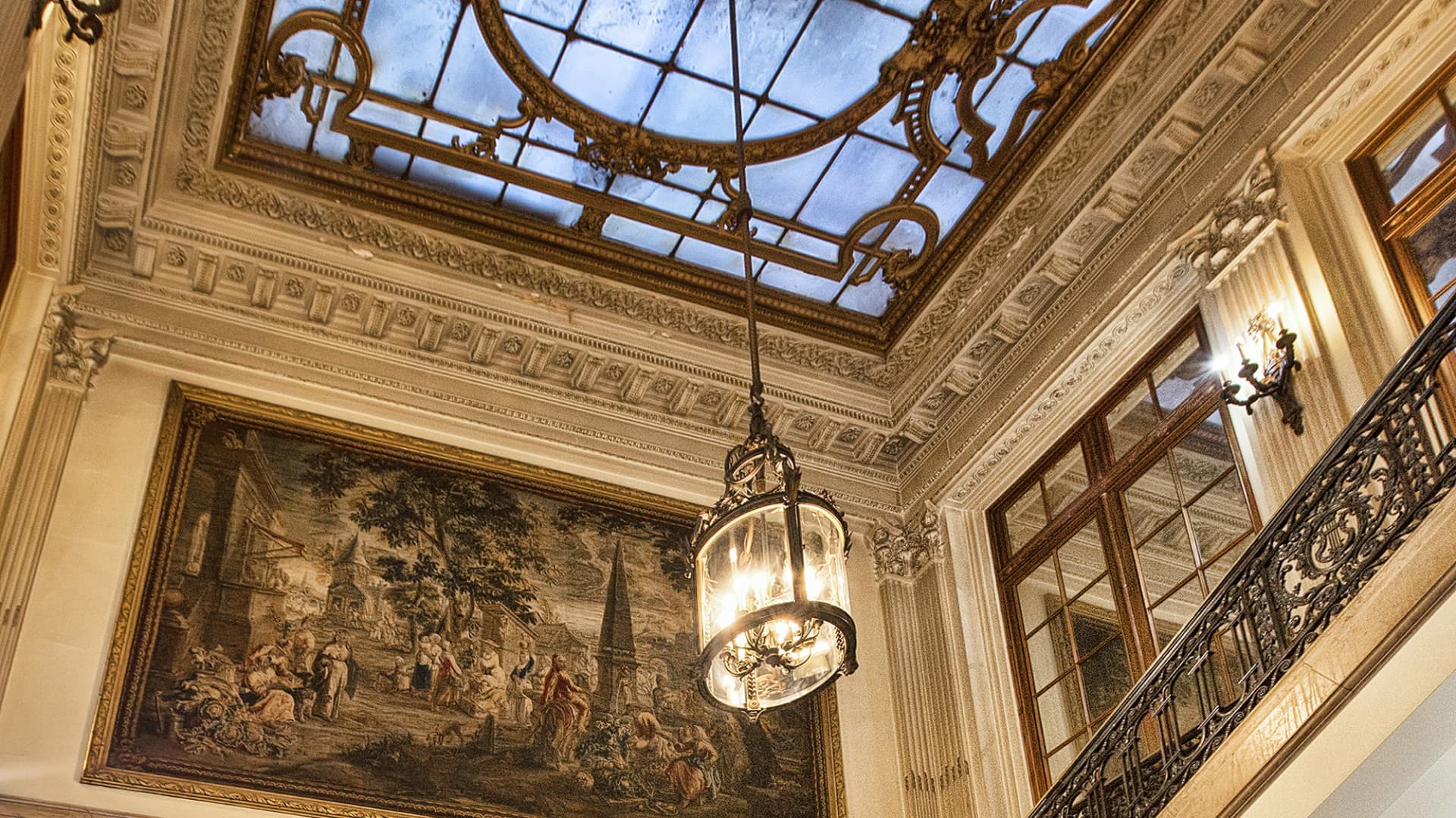 The skylight over the grand foyer is held in place by a gold-plated frame.