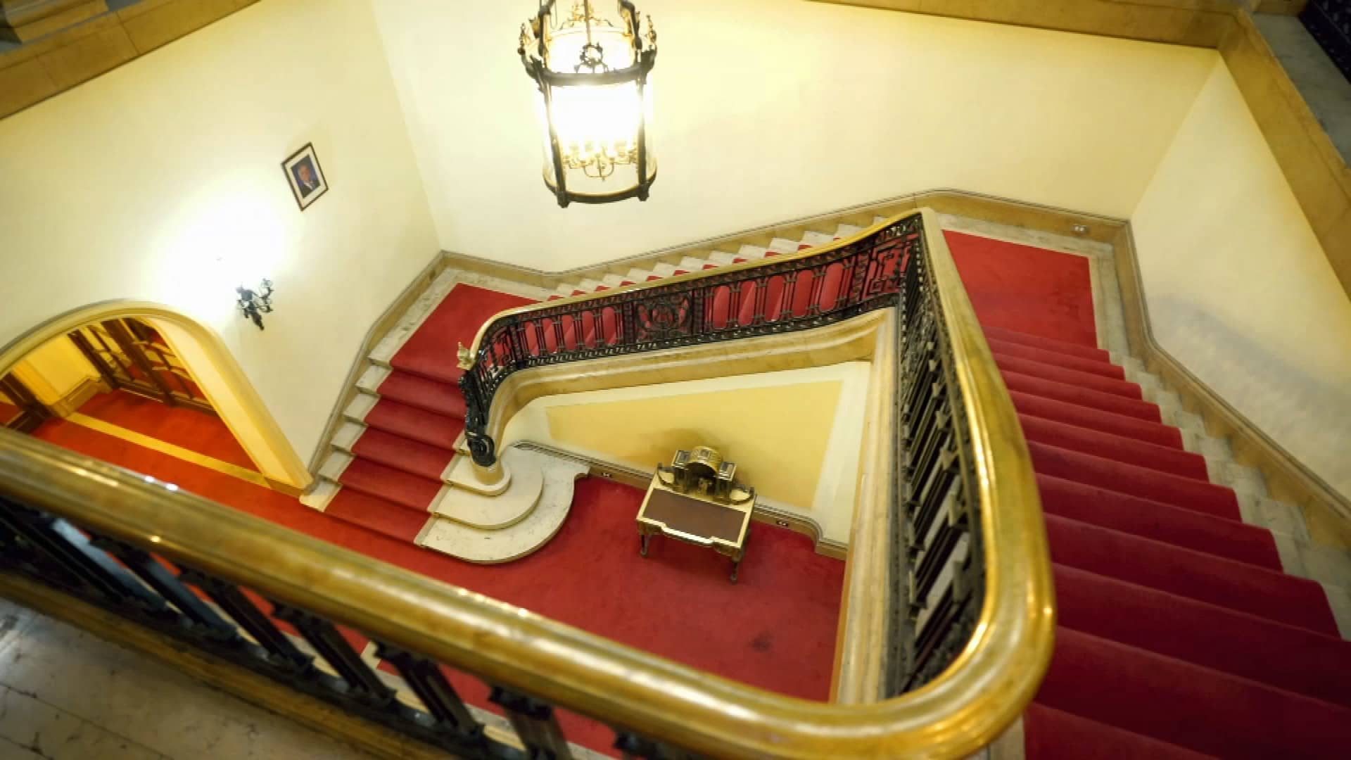 The marble staircase dominates the main foyer.