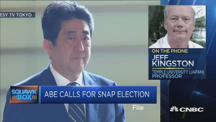 Is Japan's Abe using snap election to avoid grilling about scandals?