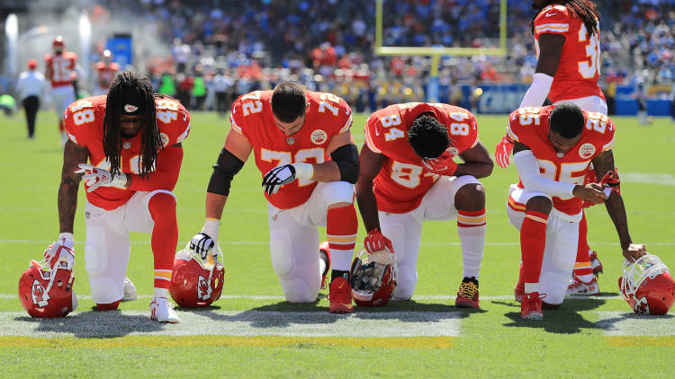 Should NFL owners fire players who sit or kneel in protest during the national anthem?