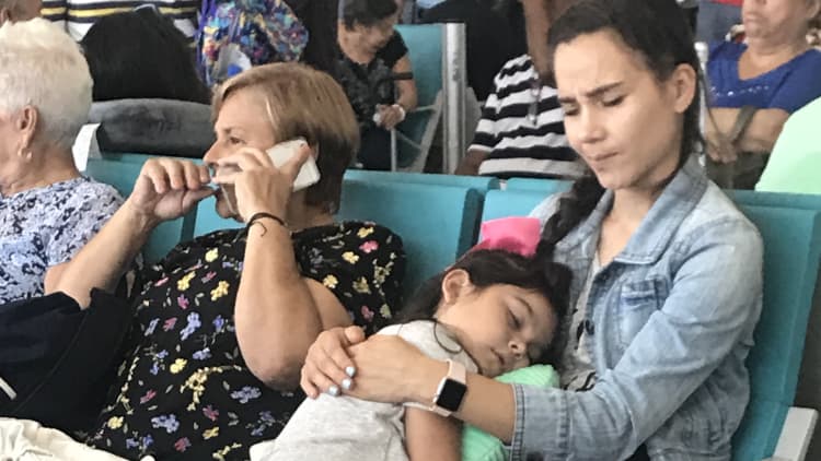 Scenes from the airport in Puerto Rico shows everyone wants off the island