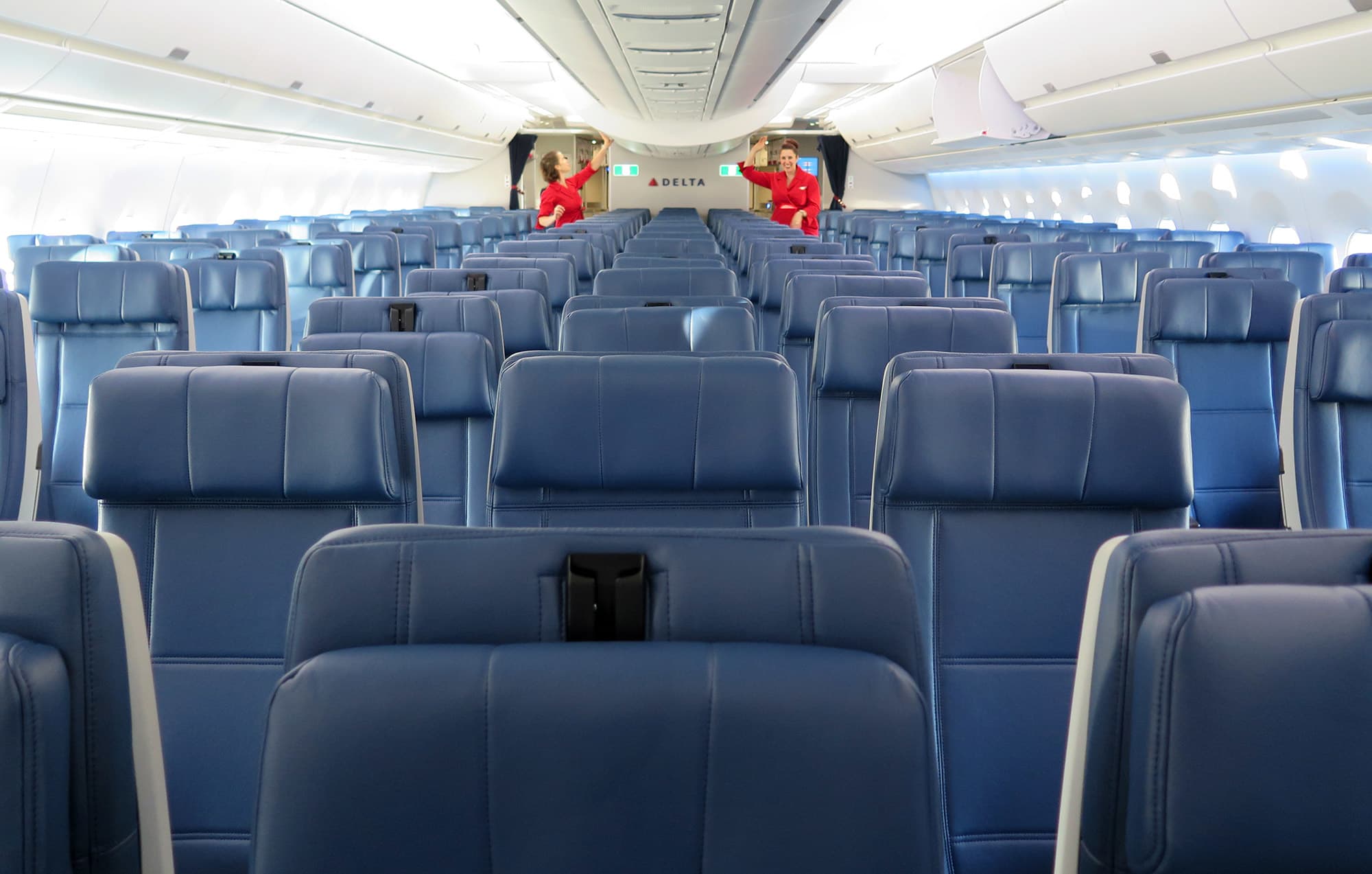 Airplane class wars are now in the coach cabin. Here's your guide