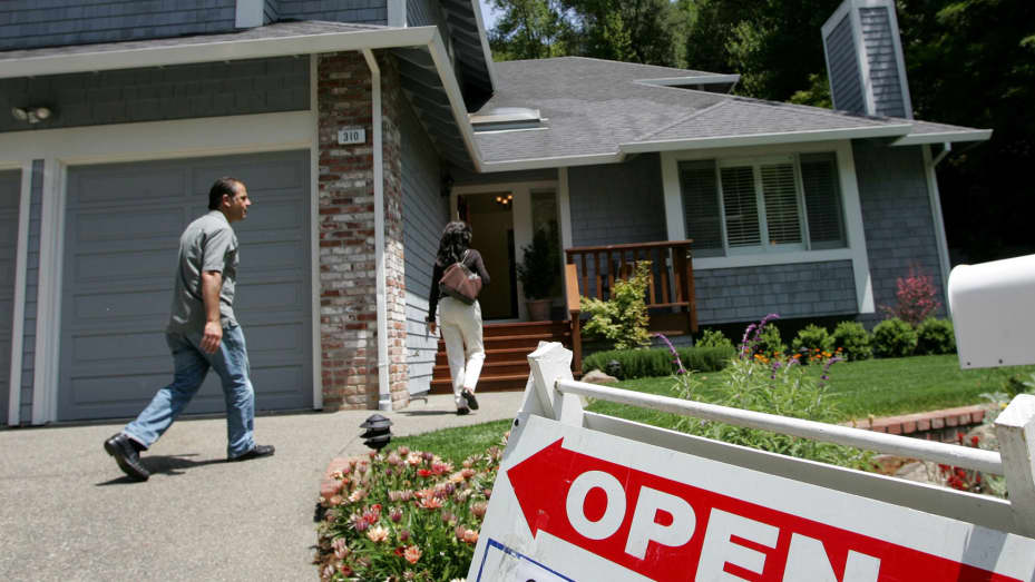Real estate agents arrive at a brokers tour showing a house for sale in San Rafael, California.