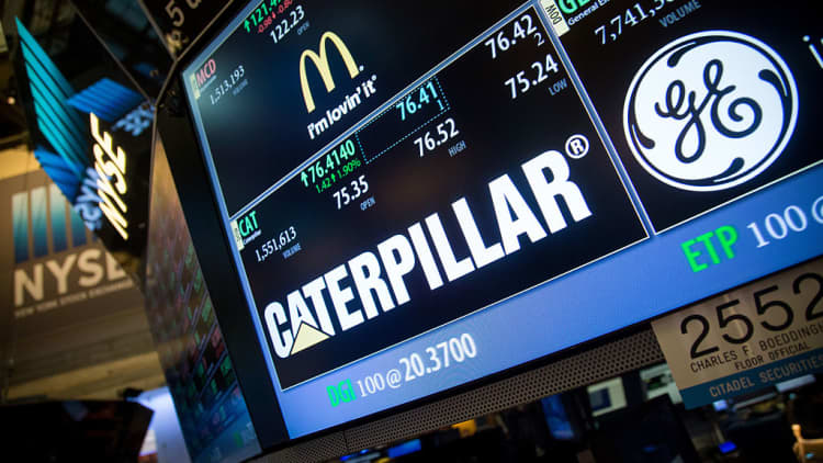Caterpillar reports earnings miss, cuts full-year outlook