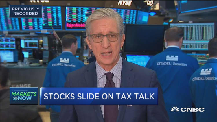 Stocks slide on tax talk