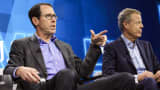 Randall Stephenson, chairman and chief executive officer of AT&T Inc., left, speaks while Jeffrey 'Jeff' Bewkes, chairman and chief executive officer of Time Warner Inc., listens during the WSJDLive Global Technology Conference in Laguna Beach, California.